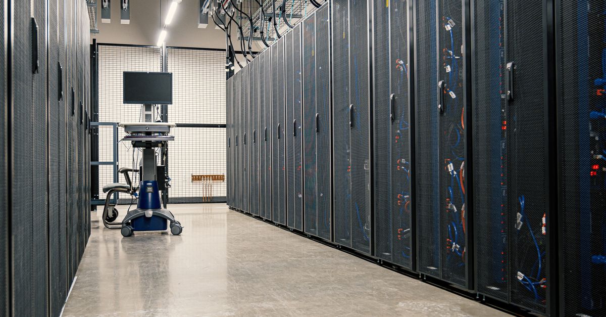 Data center corridor with server racks and cable management